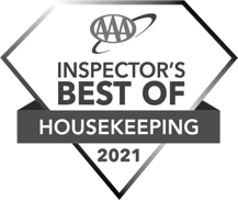 The image shows a diamond-shaped badge with the text "AAA Inspector's Best Of Housekeeping 2021" in black and white. logo on footer section.