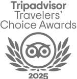 The image shows a logo for the Tripadvisor Travelers' Choice Awards 2023 featuring the iconic owl symbol surrounded by laurel leaves.