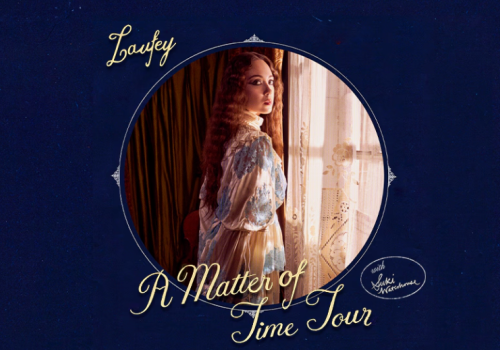 The image features a person standing by a window, with text saying "A Matter of Time Tour" and an autograph-like signature.