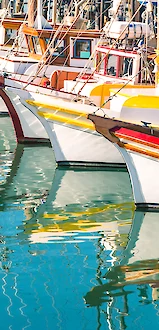 Colorful boats docked along fisherman's wharf in downtown San Francisco